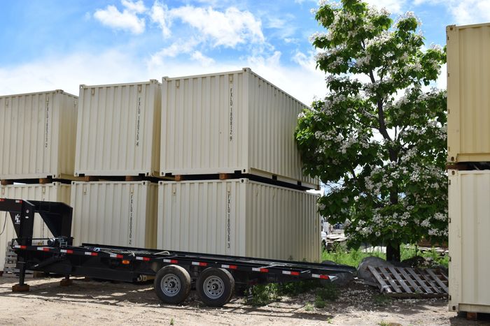 Stacked storage containers and trailer